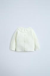 KNIT SWEATER WITH RUFFLE TRIM