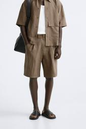 CREASED-EFFECT PLEATED BERMUDA SHORTS