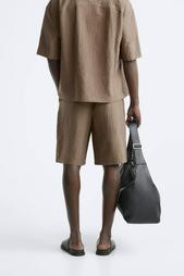 CREASED-EFFECT PLEATED BERMUDA SHORTS