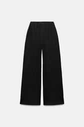 INTERLOCK KNIT TROUSERS WITH VENTS