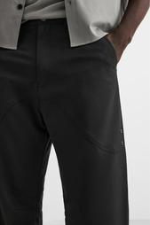 FLARED TROUSERS WITH SEAM DETAILS